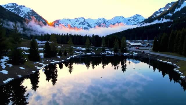 Misty morning reflections over alpine mountains and forest AI video preview