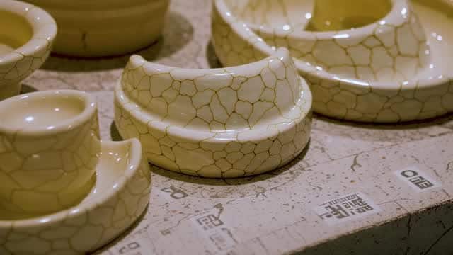 Decorative porcelain tableware with crackled gold glaze AI video preview