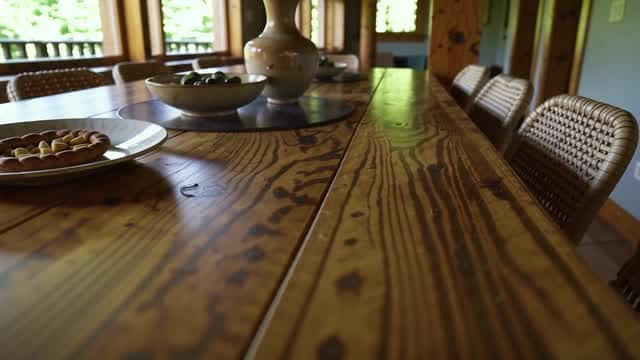 Rustic wooden table set with pastries and olives for dining AI video preview