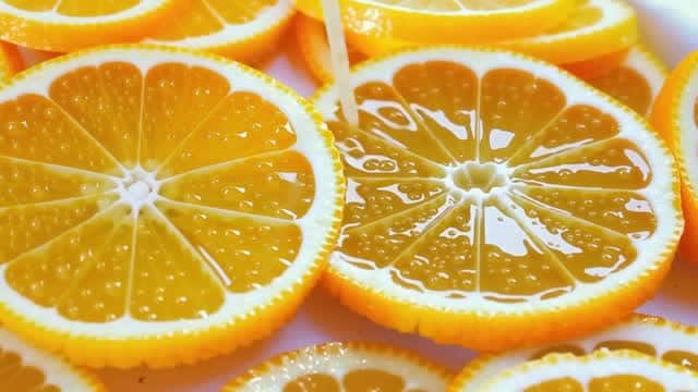 Fresh orange slices with dripping citrus juice AI video preview