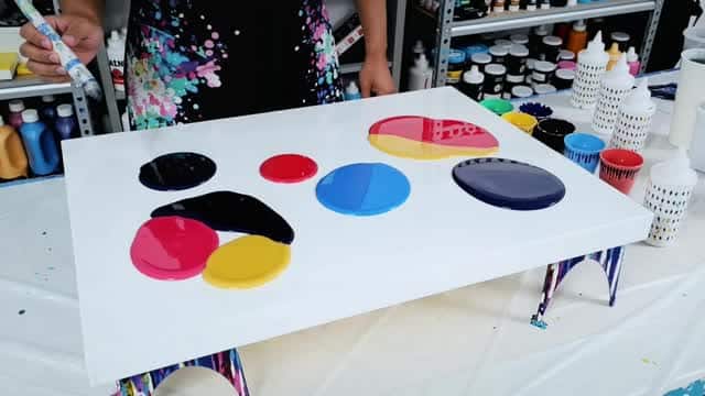 Painting colorful molds during a creative art workshop session AI video preview
