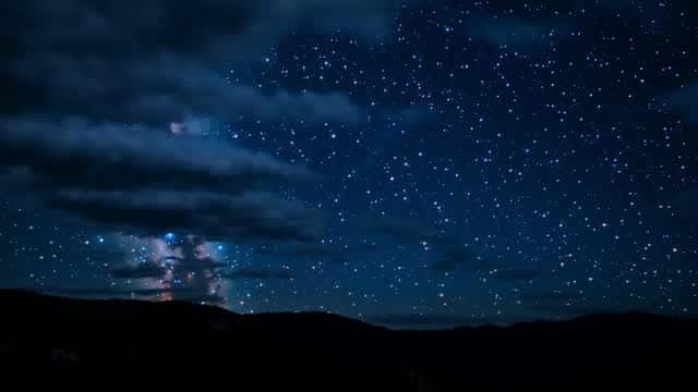 Milky Way galaxy sky over mountain silhouette at night AI video preview
