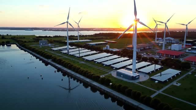 Renewable energy facility with wind turbines and solar arrays AI video preview